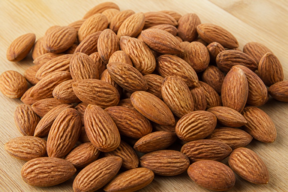 Plain almonds kept away from a dog