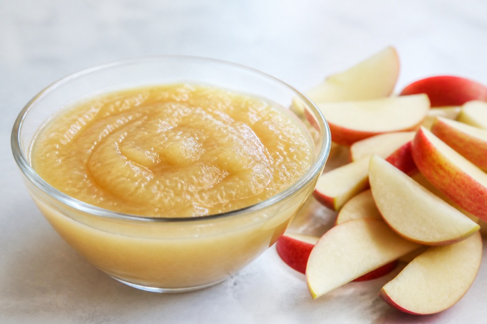 A spoonful of plain unsweetened applesauce for a dog
