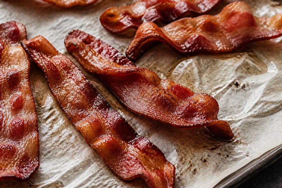Cooked bacon kept away from a dog