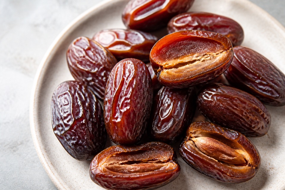 A pitted date cut into small pieces for a dog