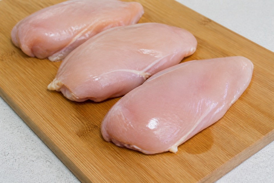 Raw chicken kept away from a dog